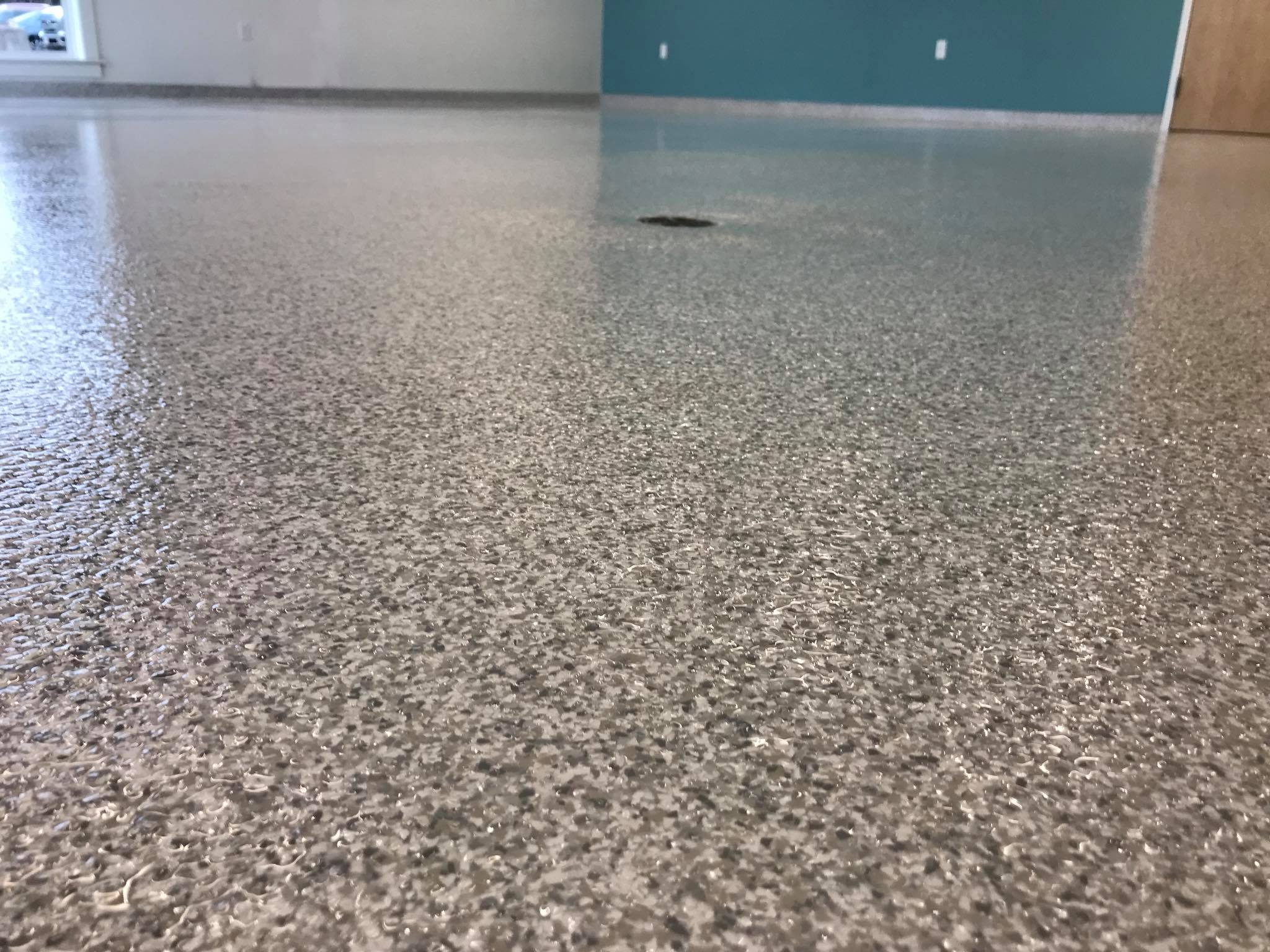 Close-up view of a completed grey decorative flake floor