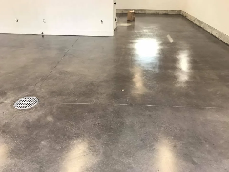 Finished concrete floor protected with a urethane-modified surface sealer