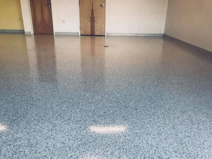 Completed grey decorative flake floor in a commercial interior