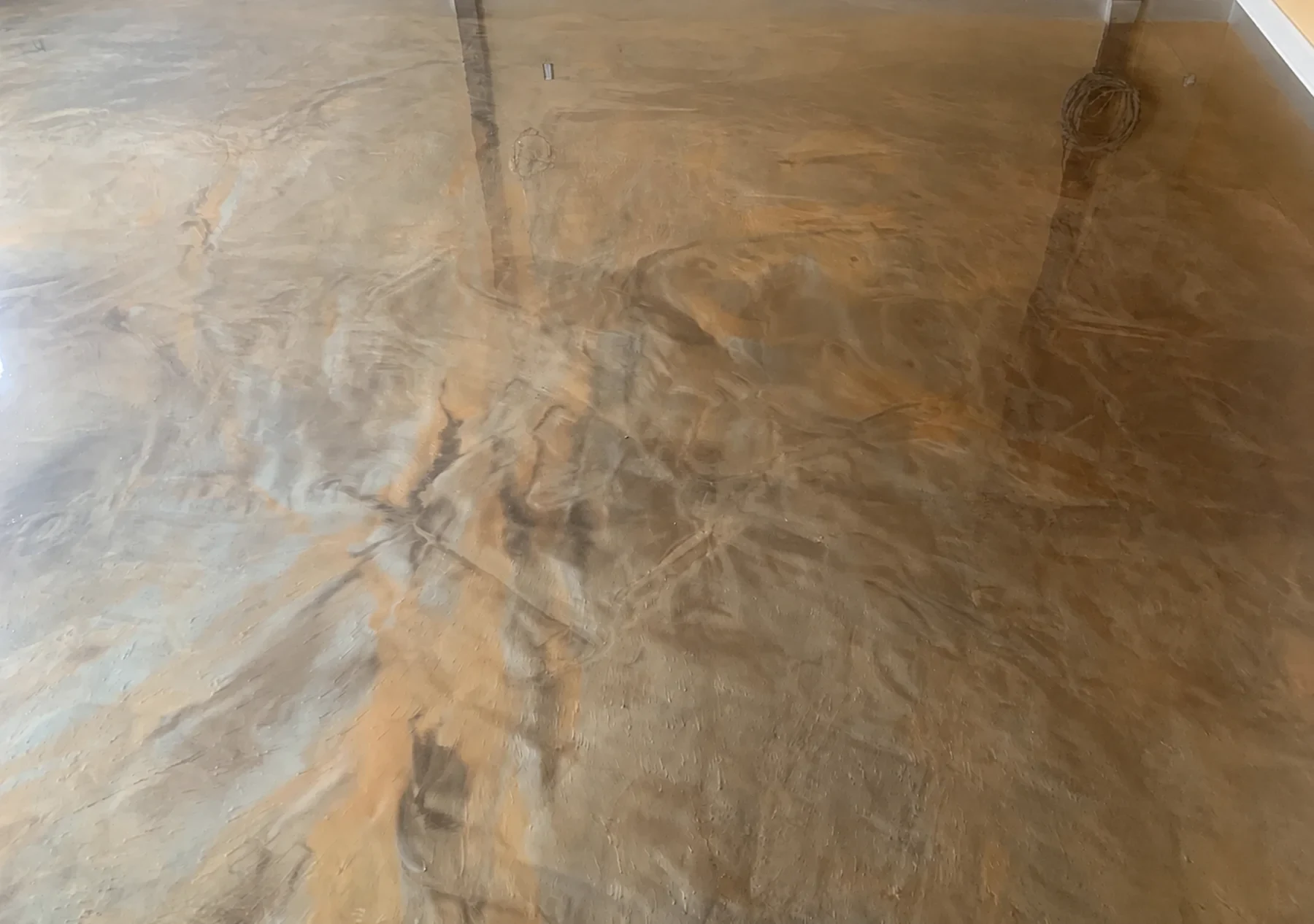 Bronze and silver metallic floor with flowing hand-applied colour movement