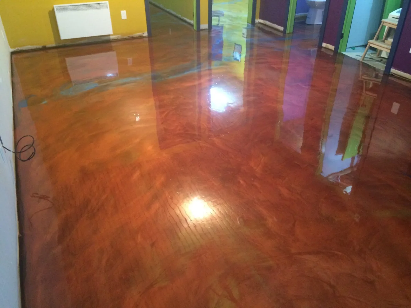 Copper metallic floor with varied hand-applied movement