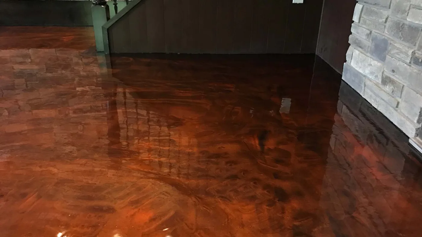 Wide view of a copper-toned metallic floor in a finished interior