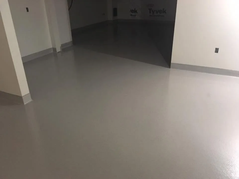 Alternate view of a grey seamless flooring installation in a commercial interior