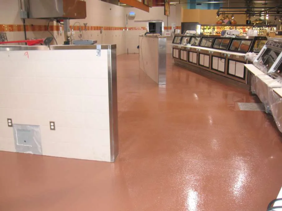 Warm red seamless epoxy floor in a commercial food-service area