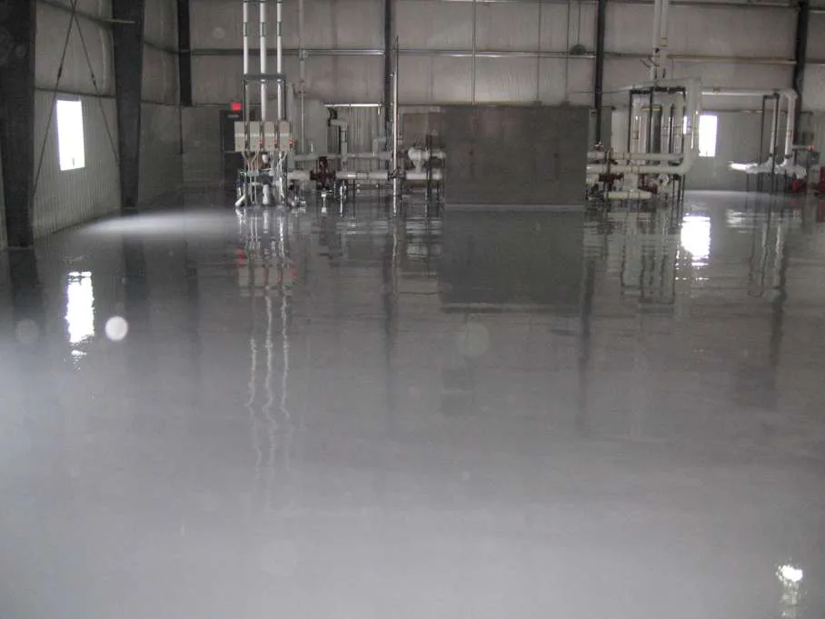Reflective grey epoxy floor in an industrial production space