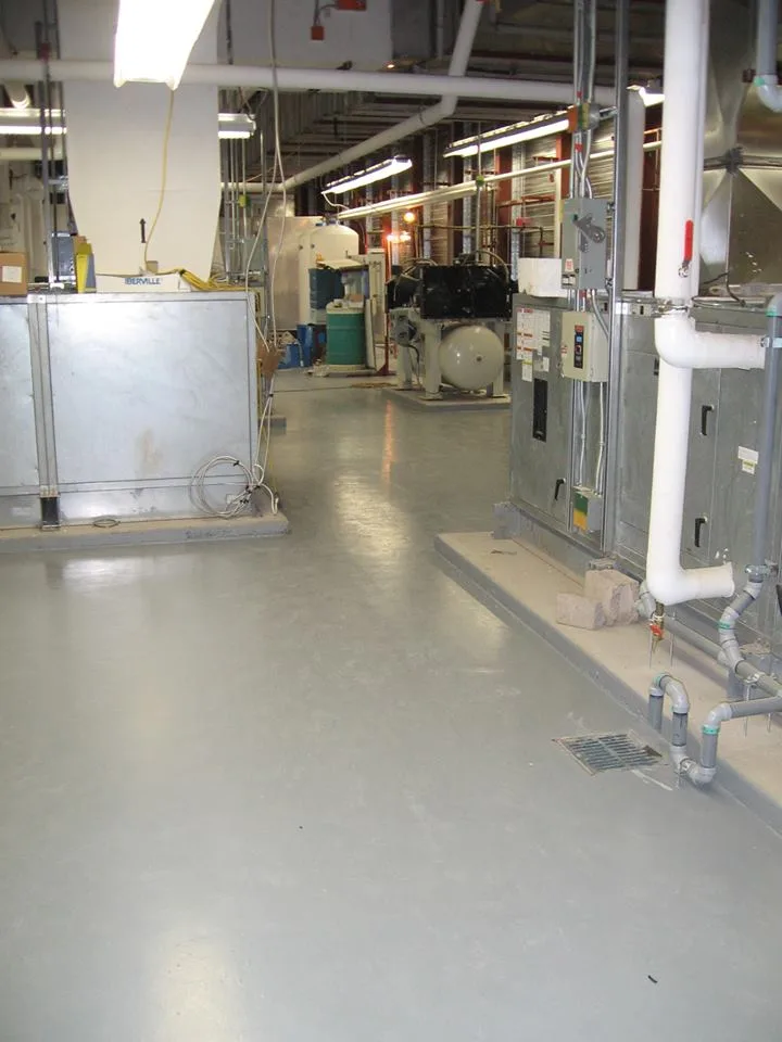 Protective membrane flooring installed around mechanical equipment
